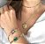 PULSEIRA CORRENTE COM PEDRARIA VERDE FOLHEADO A OURO 18K. - Imagem 2