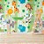 Papel de parede - Safari com animais espalhados em fundo verde listrado - Imagem 1