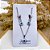 CONJUNTO COLAR E BRINCO AÇO INOX  PINGENTE OLHO GREGO AZUL CLARO - PRATEADO - Imagem 2