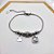 PULSEIRA COM BERLOQUES AÇO INOX  URSINHO CRAVEJADA STRASS - PRATEADA - Imagem 2