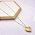 RELICÁRIO AÇO INOXIDÁVEL  55CM CORAÇÃO COM DETALHES - DOURADO - Imagem 1