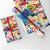 Papel Presente Bobina Couché 60CM MODELO333 Rabiscos Coloridos 100M - Imagem 3