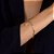 Pulseira Dourada Religiosa Nossa Senhora, Espírito Santo e Cruz Cravejada de Zircônia - Imagem 2