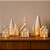 Vila Natalina - A Luz que Acolhe o Natal | 7 Peças e Vela LED - Imagem 1