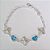 PULSEIRA FOLHEADA A PRATA COM 50 MILÉSIMOS + VERNIZ DIAMOND 18CM COM 3 TREVO 13MM E CORAÇÕES DE VIDRO AZUÍS 15MM PRPS000657 - Imagem 1