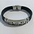 PULSEIRA EM AÇO INOXIDÁVEL EMBORRACHADA 20CM LARGURA 10MM COM TRAVA CRUCIFIXO ACPS000402 - Imagem 1