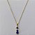 GARGANTILHA FOLHEADA A OURO CORRENTE 44CM COM PINGENTE COM PEDRAS EM ZIRCÔNIAS AZUL 5X25MM OUGG000083 - Imagem 1