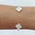 PULSEIRA (BRACELETE) FOLHEADA A PRATA COM 50 MILÉSIMOS + VERNIZ DIAMOND COM DOIS TREVOS CRAVEJADOS COM MICROS ZIRCÔNIAS 14MM PRPS000962 - Imagem 1