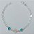 PULSEIRA FOLHEADA A PRATA COM 50 MILÉSIMOS + VERNIZ DIAMOND - PULSEIRA TREVO COM PEDRAS AZUÍS - TAMANHO: 18CM - FECHO LAGOSTA PRPS001042 - Imagem 1