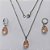 CONJUNTO EM AÇO INOXIDÁVEL - (AÇO03) CONJUNTO COM CORRENTE 50CM E BRINCOS ARGOLAS DE PRESSÃO COM PINGENTES EM ZIRCÔNIAS SALMÃO FUSION 10X14MM - COMPOSIÇÃO: AÇO INOXIDÁVEL - (AÇO1641) ACCJ000043 - Imagem 1