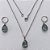 CONJUNTO EM AÇO INOXIDÁVEL - (AÇO03) CONJUNTO COM CORRENTE 50CM E BRINCOS ARGOLAS DE PRESSÃO COM PINGENTES EM ZIRCÔNIAS CINZAS FUSION 10X14MM - COMPOSIÇÃO: AÇO INOXIDÁVEL - (AÇO1646) ACCJ000048 - Imagem 1