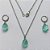 CONJUNTO EM AÇO INOXIDÁVEL - (AÇO03) CONJUNTO COM CORRENTE 50CM E BRINCOS ARGOLAS DE PRESSÃO COM PINGENTES EM RESINA FOSCAS VERDES CLARAS 10X14MM - COMPOSIÇÃO: AÇO INOXIDÁVEL - (AÇO1656)) ACCJ000057 - Imagem 1