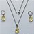 CONJUNTO EM AÇO INOXIDÁVEL - (AÇO03) CONJUNTO COM CORRENTE 50CM E BRINCOS ARGOLAS DE PRESSÃO COM PINGENTES EM ZIRCÔNIAS AMARELAS 10X14MM - COMPOSIÇÃO: AÇO INOXIDÁVEL - (AÇO1658) ACCJ000059 - Imagem 1