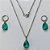CONJUNTO EM AÇO INOXIDÁVEL - (AÇO03) CONJUNTO COM CORRENTE 50CM E BRINCOS ARGOLAS DE PRESSÃO COM PINGENTES EM ZIRCÔNIAS VERDES 10X14MM - COMPOSIÇÃO: AÇO INOXIDÁVEL - (AÇO1665) ACCJ000068 - Imagem 1
