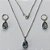CONJUNTO EM AÇO INOXIDÁVEL - (AÇO03) CONJUNTO COM CORRENTE 50CM E BRINCOS ARGOLAS DE PRESSÃO COM PINGENTES EM ZIRCÔNIAS CINZAS 10X14MM - COMPOSIÇÃO: AÇO INOXIDÁVEL - (AÇO1666) ACCJ000069 - Imagem 1