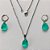 CONJUNTO EM AÇO INOXIDÁVEL - (AÇO03) CONJUNTO COM CORRENTE 50CM E BRINCOS ARGOLAS DE PRESSÃO COM PINGENTES EM ZIRCÔNIAS VERDES 10X14MM - COMPOSIÇÃO: AÇO INOXIDÁVEL - (AÇO1675) ACCJ000078 - Imagem 1