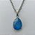 CONJUNTO EM AÇO INOXIDÁVEL - (AÇO03) GARGANTILHA COM CORRENTE 50CM E PINGENTE EM RESINA AZUL COM BRILHOS 3X7MM - COMPOSIÇÃO: AÇO INOXIDÁVEL - (AÇO1828) ACCJ000091 - Imagem 2