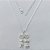 GARGANTILHA FOLHEADA A PRATA COM 50 MILÉSIMOS + VERNIZ DIAMOND - GARGANTILHA CORRENTE VENEZIANA 45CM + EXTENSOR COM PINGENTE CANGA CORAÇÕES COM MENINO E MENINA CRAVEJADO EM MICROS ZIRCÔNIAS 16X26MM - (PRA255) PRGG001420 - Imagem 1