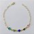 PULSEIRA FOLHEADA A OURO - BANHADO COM 3 MILÉSIMOS + VERNIZ DIAMOND - TAMANHO 20CM COM PEDRAS CRISTAIS COLORIDAS E BORBOLETAS COLORIDAS OUPS0000106 - Imagem 1