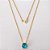 GARGANTILHA FOLHEADA A OURO - BANHADO COM 5 MILÉSIMOS + VERNIZ DIAMOND - CORRENTE CADEADO 45CM E PINGENTE EM ZIRCÔNIA REDONA AZUL CLARO 10MM - (OURO1172) OUGG000243 - Imagem 1