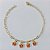 PULSEIRA FOLHEADA A OURO - BANHADO COM 3 MILÉSIMOS + VERNIZ DIAMOND - PULSEIRA 20CM COM BORBOLETAS VERMELHAS DE VIDRO OUPS000197 - Imagem 1