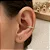 Piercing de Torção Meia Argola Cravejada Zircônias Redondas 12mm - Imagem 1