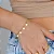 Pulseira Palitinhos Pingente Moeda - Imagem 1