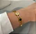 BRACELETE DOURADO AÇO INOX PRETO E CRISTAL - Imagem 1