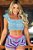 Conjunto Cropped e Short em Tricô Curto com Gola Aberta e Alça Babada - Imagem 1