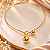 Choker - CHOKER ARO LARGO COM FECHAMENTO FRONTAL COM ESFERAS, DIÂMETRO APROXIM.15CM, BANHO 18K - Imagem 1