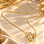 Conjunto - CONJ 2PÇ GARG CADEADINHO 45CM E PING CORAÇÃO DUPLO COM PASSA FIO CRAVEJADO DE ZIRCONIAS 18K - Imagem 1