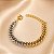 BRACELETE LUXO ELO GROUMET 2 CORES - Imagem 1