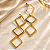 Brinco - BRINCO QUADRADOS PENDENTES COM MOVIMENTO PINO E TARRAXA 60 X 22mm 18K - Imagem 1