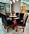 CONJUNTO MESA MARK 130X130 CANELA + 6 CADEIRAS MODELO 19 MARROM + PRATO GIRATÓRIO - Imagem 1