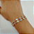 Pulseira Religiosa 24 Santos Folheada a Ouro 18K - Imagem 2