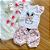 Conjunto Blusa Manga Curta Branca Coelho e Shorts Estampado Bebê Lilás tamanho 3 a 6 meses - Imagem 1