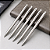 KIT 5 CANETAS ESFEROGRÁFICAS GRAVAÇÃO AÇO INOX PONTA MÉDIA - Imagem 1