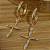 BRINCO ARCOLA CRUCIFIXO - Imagem 1