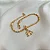 Pulseira Feminina Berloque Cavalo e Ferradura Ródio no Cordão Baiano Banhado a Ouro 18k - Imagem 1