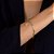 Pulseira Dourada Religiosa Nossa Senhora, Espírito Santo e Cruz Cravejada de Zircônia - Imagem 2
