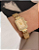 Relógio Dourado Retangular Cravejado Fundo Bege - Imagem 1