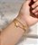 PULSEIRA DUPLA CORRENTE ESFERA E PINGENTE BORBOLETA JATEADA AÇO DOURADO 316L⭐️ - Imagem 1