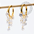 TN2275 Brincos Argola Pingente 9 CZ Titânio PVD Gold - Imagem 1