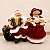 Casal Papai Noel e Mamãe Noel decorativos no banco 28 cm - Imagem 1