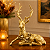 Rena Decorativa de Natal Deitada em Resina Dourada Fosca com Detalhes Prata Envelhecido – 34 cm - Imagem 1