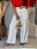 Calça Alfaiataria Branca Pantalona Evasê Com Passantes E Bolsos Frente - Imagem 5
