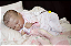 Boneca Bebê Reborn Menina Spencer 49 Cm Olhos Fechados Bebê Gordinha Linda Encantadora Com Enxoval - Imagem 4