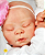 Bebê Reborn Menina Kaelin 40 Cm Olhos Fechados Bebê Realista Linda Princesinha Com Chupeta E Enxoval - Imagem 4
