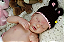 Boneca Bebê Reborn Menina Indie 47 Cm Olhos Fechados Corpo Vinil Siliconado Parece Um Bebê De Verdade - Imagem 4