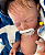 Bebê Reborn Menino Silicone Sólido 43 Cm Olhos Fechados Pode Tomar Banho Acompanha Enxoval E Chupeta - Imagem 4